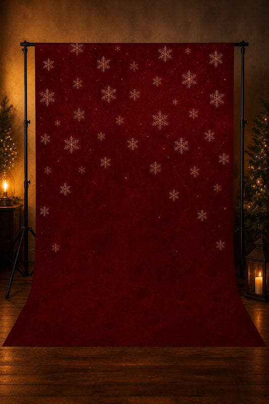 Burgundy & Gold Snowflakes photography backdrop displayed on a stand